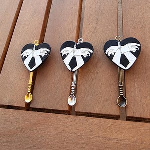Cuffed Hands Spoon Pendant