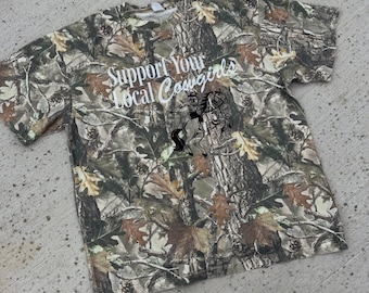 Camiseta de camuflaje "Apoya a tus vaqueras locales" de algodón grueso.