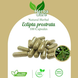 May include: A bottle containing 100 natural herbal Eclipta prostrata capsules. The bottle is labelled with the brand name "Herba Care" and the words "Natural Herbal" and "100 Capsules". The bottle is surrounded by green leaves and a small plant with white flowers.