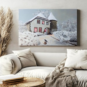 May include: A snowy winter scene with a small cottage with lit windows and a black bird perched on a boot in the snow.