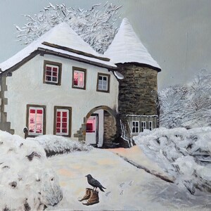 May include: A white, snow-covered house with a stone tower and red-framed windows. The house is surrounded by snow-covered trees and bushes. A small bird is perched on a rock in the foreground.