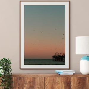 Brighton Beach Golden Hour Wall Art Print – Sunset Coastal Photography, Seascape Décor, Blue and Orange Sky with Birds Flying