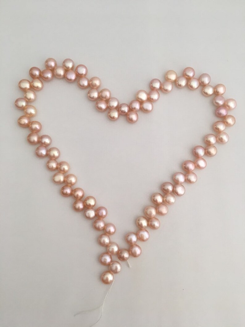 A string 16/" shell nuggets light pink 8mm beads