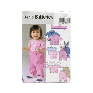 May include: A sewing pattern for baby clothes, featuring a pink and white gingham shirt, a pink jacket, blue overalls, and pink pants. The pattern is from Butterick and is labeled B4215.