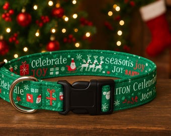 May include: A green Christmas-themed dog collar with the words "Celebrate Joy" and "Season's Joy" in white. The collar features Santa Claus, reindeer, and gift box graphics. It has a black plastic buckle and a silver metal D-ring.