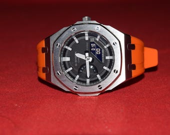 Specialdesignad G-Shock rostfritt stål och orange Casio GA-2100