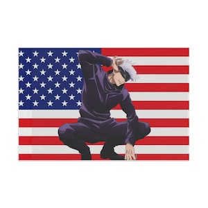 May include: A rectangular wall art print featuring an anime character with white hair and a black blindfold, wearing a dark purple high-collar uniform, crouching in a dynamic pose against a background of the American flag with red, white, and blue.