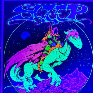 May include: A blacklight poster featuring a neon green creature with a rider, set against a starry night sky. The creature has a pink head and purple cape. The word "SLEEP" is written in a stylized font at the top.