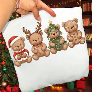 May include: White pillowcase with four festive teddy bear illustrations. One is dressed as Santa, another as a reindeer with a candy cane, a third as a Christmas tree, and the last as a gingerbread bear, all on a white background.