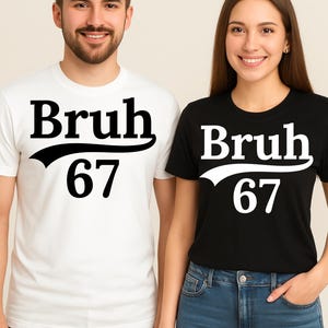 May include: Two people wearing matching t-shirts. One shirt is white, the other is black. Both shirts have the word "Bruh" above the number "67" in a bold, black font.