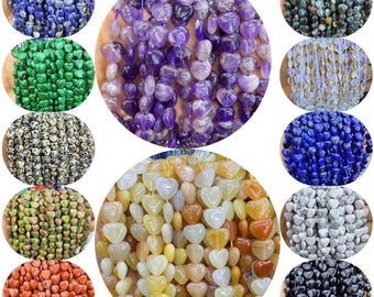 May include: Assortment of heart-shaped gemstone beads in various colors, including purple amethyst, blue lapis lazuli, green malachite, white moonstone, black onyx, and brown jasper.