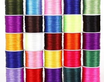 Rollo de 10/60 m de hilo elástico plano de cristal transparente de 0,4 mm, resistente y de colores surtidos, para hacer collares, bisutería y abalorios.