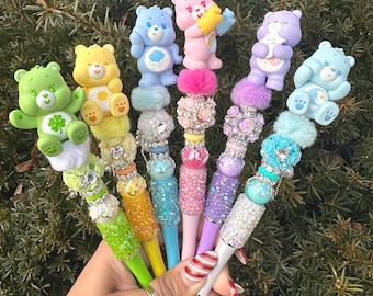 Bolígrafos con cuentas CARE BEARS GLAM, personajes que elevan tu estación de papelería.