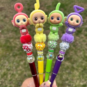 TELETUBBIES beaded pens , characters , cute pens, elevate your station at school or the office with these beautiful unique pens.