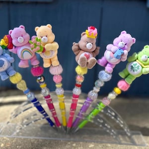 CARE BEARS  beaded pens , characters , elevate your stationary station.