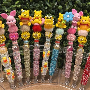 Winnie the pooh beaded rhinestone pens.