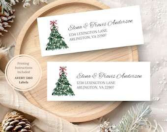 May include: Two white address labels with a watercolor Christmas tree design. The labels include the names "Elena & Travis Anderson" and address details. A circular label indicates "Printing Instructions Included".