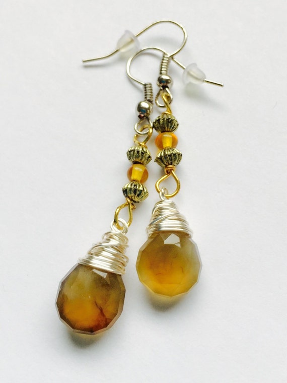 Items similar to Long wire wrapped chalcedony earrings. Brown ...