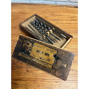 May include: A set of three ceramic mugs with a speckled, matte finish. The mugs are in shades of cream, light gray, and dark gray. Each mug has a simple, minimalist design and a rounded handle. Perfect for coffee or tea.