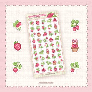 以下が含まれることがあります： 「Strawberry Doodles」と「Deco Sticker Sheet」の文字が入った、イチゴをテーマにした装飾ステッカーシート。ステッカーには、イチゴ、葉、バスケット、リボンがピンク、赤、緑で描かれています。背景はピンクのグリッドです。