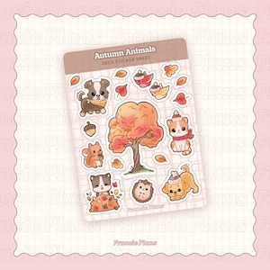 以下が含まれることがあります： 「Autumn Animals」と題されたステッカーシート。秋をテーマにした動物と要素のイラストが特徴です。犬、猫、リス、ハリネズミ、木などのステッカーは、すべて秋の色合いです。シートは、テキスト「Autumn Animals DECO STICKER SHEET」が入った薄茶色の背景です。