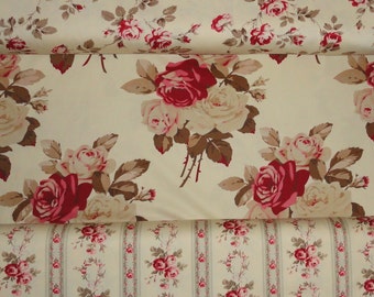 May include: A fabric featuring a cream background with a repeating floral pattern of deep red and pale pink roses accompanied by brown leaves. The design includes sections with large rose clusters and sections with vertical stripes and small roses.