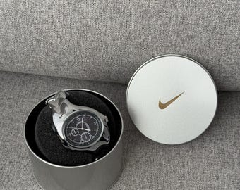 The Nike Triax Armored Chrono watch is a classic model with an innovative design, a retro-inspired accessory silver chrome avantgarde case