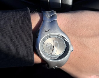 The Nike Triax Armored Chrono watch is a classic model with an innovative design, a retro-inspired accessory silver avantgarde y2k