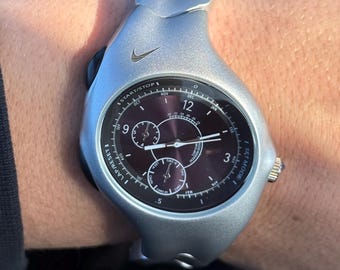 The Nike Triax Armored Chrono watch is a classic model with an innovative design, a retro-inspired accessory silver avantgarde y2k