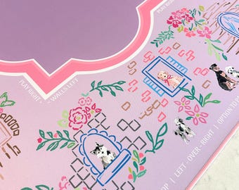 May include: A decorative, light purple game board with floral and dog illustrations. The board features a pink border and text that reads "PLAY RIGHT" and "WALLS LEFT". The design includes a variety of dog breeds and floral elements.