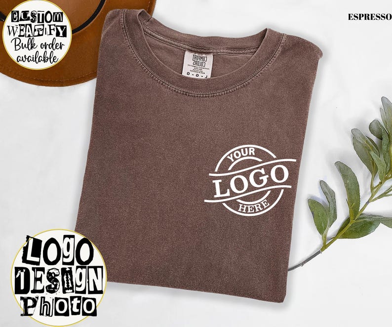 a brown t-shirt with a white logo on it, along with some greenery and text related to a custom design.