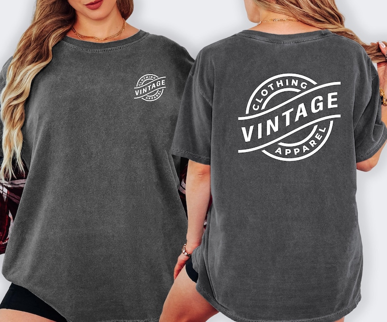 a woman wearing a gray t-shirt with the text "CLOTHING VINTAGE APPAREL" printed on the back.