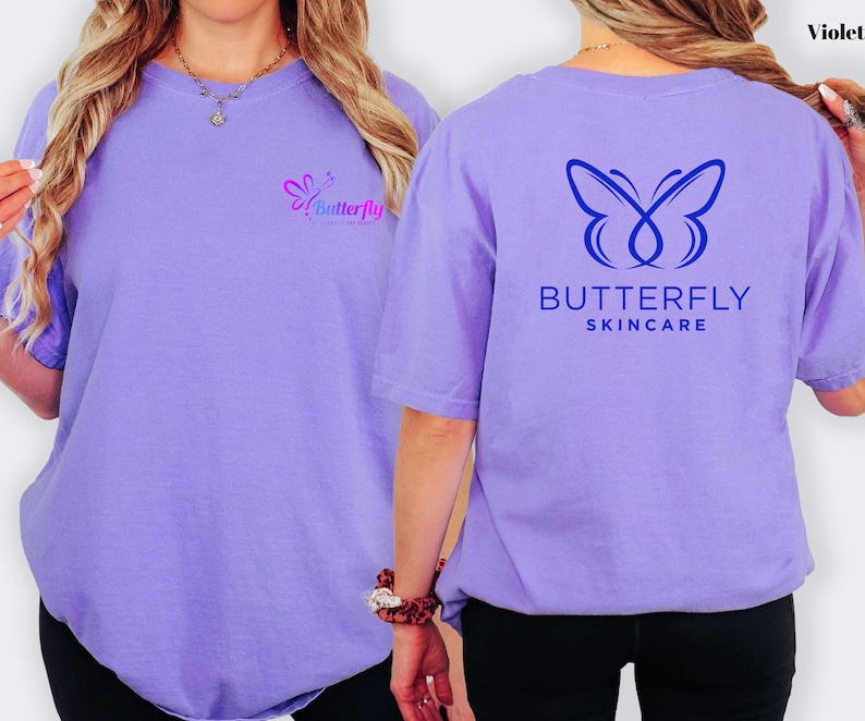 a woman wearing a purple t-shirt with a butterfly logo and text on the back.