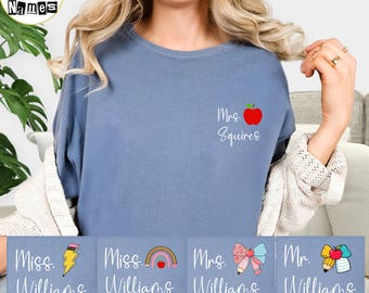 May include: A blue t-shirt with the text "Mrs. Squires" and a red apple graphic. Below are four rectangular designs with teacher-themed graphics and names: "Miss Williams", "Miss Williams", "Mrs. Williams", and "Mr. Williams". The words "CUSTOM Shape Names" are at the top left.