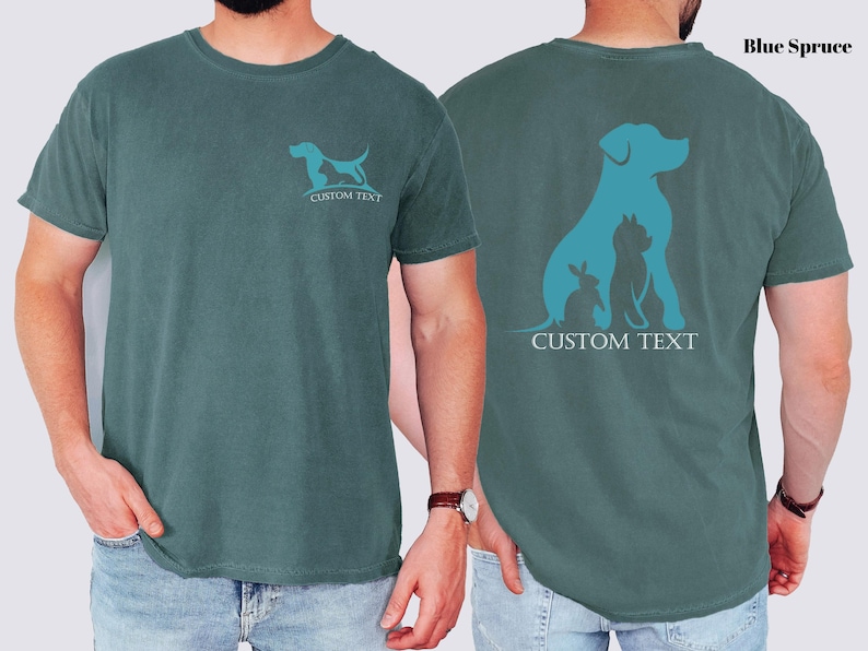 A man wearing a green t-shirt with a graphic design of a dog and a cat on the front and back.