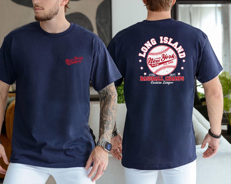 two men wearing navy blue t-shirts with the text "Long Island New York" and "At the 2013 Baseball Champs" printed on them.