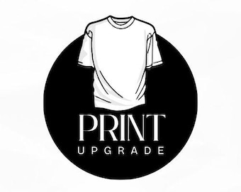 May include: A white t-shirt illustration is centered on a black circle. The words "PRINT UPGRADE" are displayed in a bold, serif font below the t-shirt graphic. The design is simple and clean, with a focus on the t-shirt.