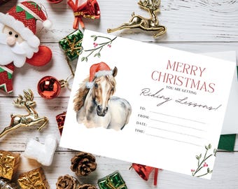 May include: A white Christmas gift card with red text that says "Merry Christmas You Are Getting Riding Lessons!" with a watercolor illustration of a brown and white horse wearing a red Santa hat. The card has blank lines for the recipient, giver, date, and time.