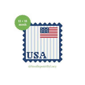 May include: A square design featuring the American flag and the word "USA" in pixelated letters. The design is framed with a dark blue border, and the text "13 + 18 mesh" is in a green circle. The artist's name, "@NeedlepointByLucy", is at the bottom.