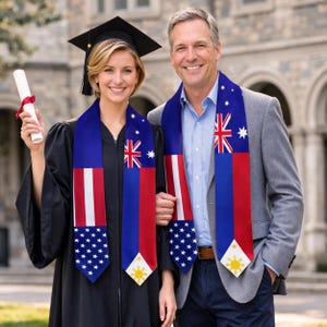 May include: A woman in a graduation gown and a man wearing graduation stoles featuring the flags of the United States, Australia, and the Philippines. The woman holds a diploma. The stoles are blue, red, and white with star and sun designs.