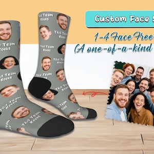 May include: Custom face socks with a gray background and black heels. The socks are covered with smiling faces and the text "This Team Rocks". The image also includes a photo of a group of people and the text "1-4 Face Free (A one-of-a-kind gift)".