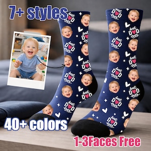 May include: Navy blue socks with a repeating pattern of a baby's face, hearts, and the text "best DAD ever." The socks have black heels and toes. The image also includes the text "7+ styles," "40+ colors," and "1-3 Faces Free."
