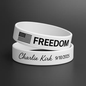 May include: Two white silicone wristbands. One band features the word "FREEDOM" with an American flag graphic. The other band has the text "Charlie Kirk 9/10/2025".