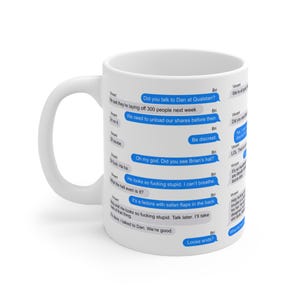 May include: White ceramic coffee mug with a curved handle. The mug is covered in blue text message bubbles with various phrases. The phrases include "Did you see Brian's hat?" and "Loose ends?"