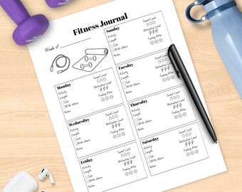 May include: A fitness journal with a black pen, a blue water bottle, and purple dumbbells. The journal is open to a blank page with sections for daily activity, length, and notes. White wireless earbuds are also visible.