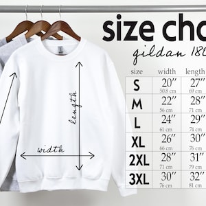 a size chart for a sweatshirt hanging on a wall