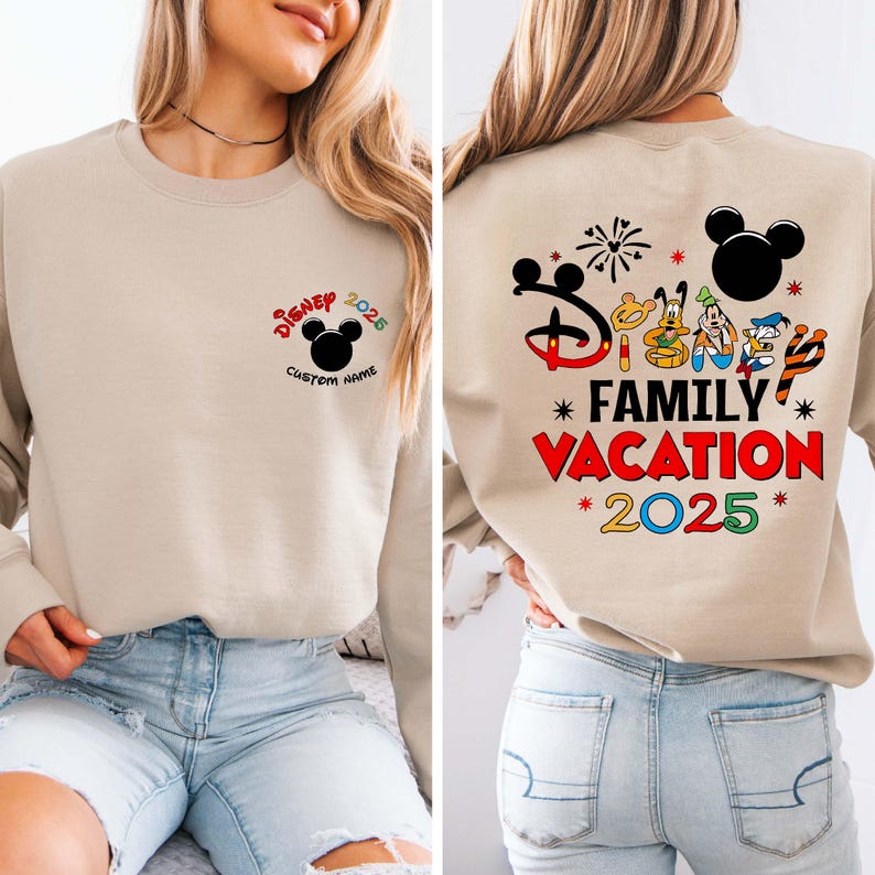 May include: Beige sweatshirt with Disney graphics. The front has a Mickey Mouse head and "Disney 2025" with a space for a custom name. The back shows "Family Vacation 2025" with Disney characters and fireworks.