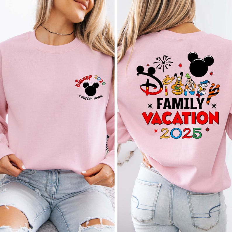 May include: A pale pink sweatshirt featuring the text "Disney 2025" and a Mickey Mouse head on the front. The back of the sweatshirt displays "Family Vacation 2025" with Disney character graphics.