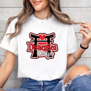 Experience the magic of Tokyo DisneySea in comfort and style with this vintage-inspired Comfort Colors® tee! Perfect for Disney family vacations or group trips, this soft and durable shirt makes a fun and memorable matching outfit. Whether you're walking the park or capturing group photos, this tee celebrates your Tokyo DisneySea adventure in a colorful and comfy way!