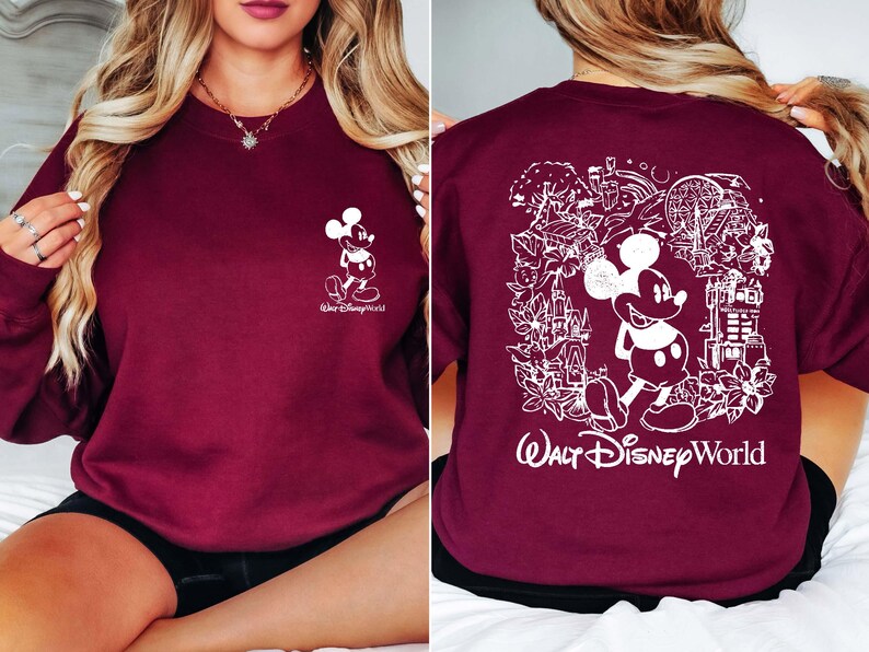 May include: Burgundy sweatshirt with a white Mickey Mouse graphic on the front and a white Mickey Mouse graphic with a scene of Walt Disney World on the back. The text "Walt Disney World" is printed below the graphic.